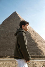 Load image into Gallery viewer, THE ASILI KNITTED COLLECTION (Pyramids’ Coordinates Edition) in Olive Green.
