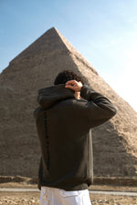 Load image into Gallery viewer, THE ASILI KNITTED COLLECTION (Pyramids’ Coordinates Edition) in Olive Green.
